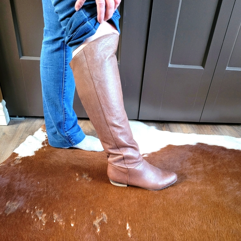 Steve Madden knee high leather boots.